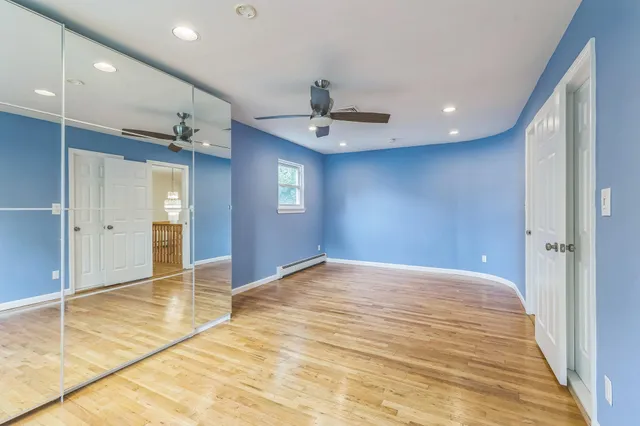a view of an empty room with a chandelier