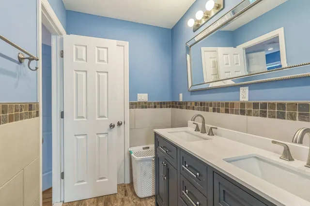 a bathroom with a sink and a mirror