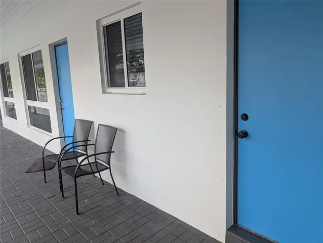 a work room with furniture and windows