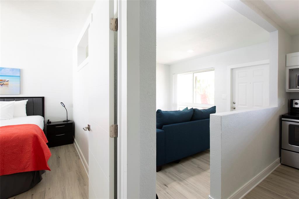 3217 Northeast 9th Street, Unit 5 Pompano Beach, FL 33062 - Photo 10 of 12 a living room with furniture and a window