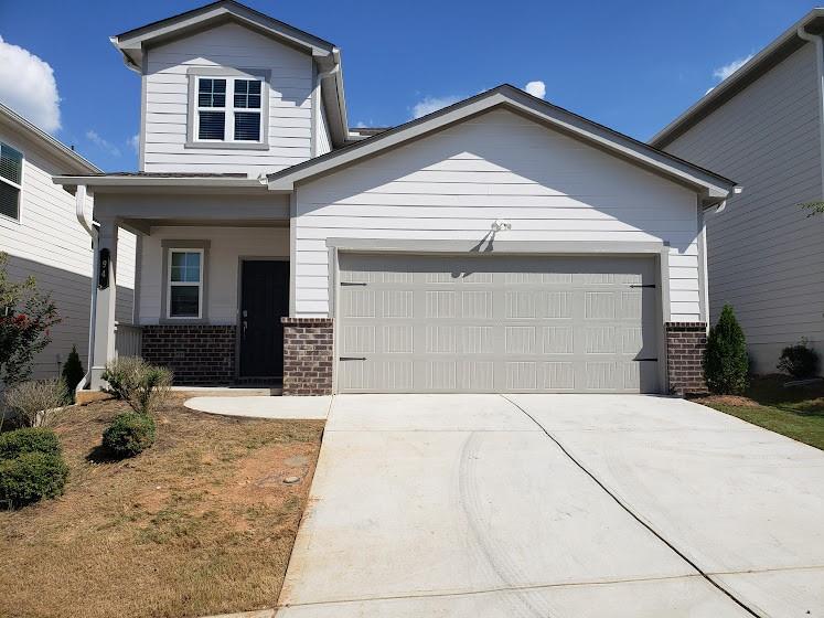 a front view of a house with yard