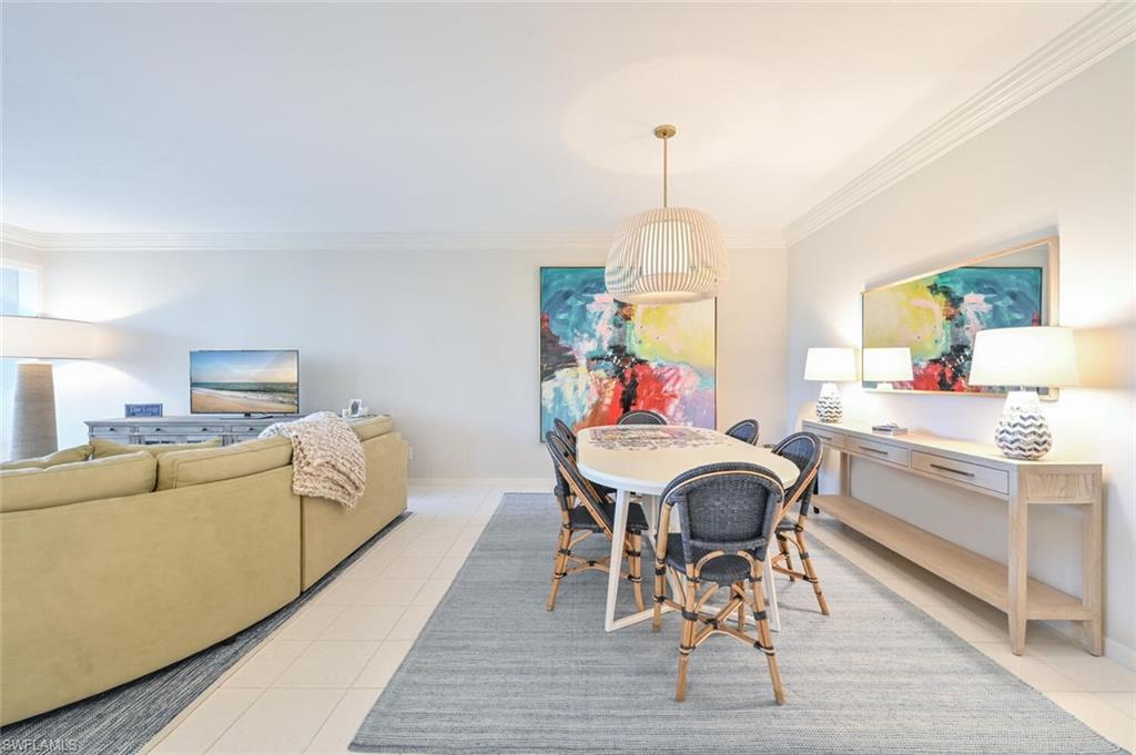 6549 Marissa Loop, Unit 26 Naples, FL 34108 - Photo 12 of 39 a living room with furniture and a wooden floor