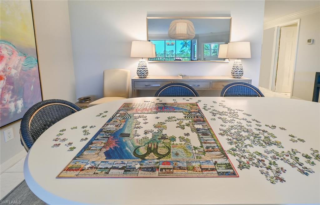 6549 Marissa Loop, Unit 26 Naples, FL 34108 - Photo 15 of 39 a living room with a bed