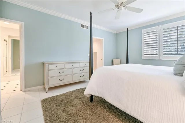 a large white bathroom with a large tub sink and vanity