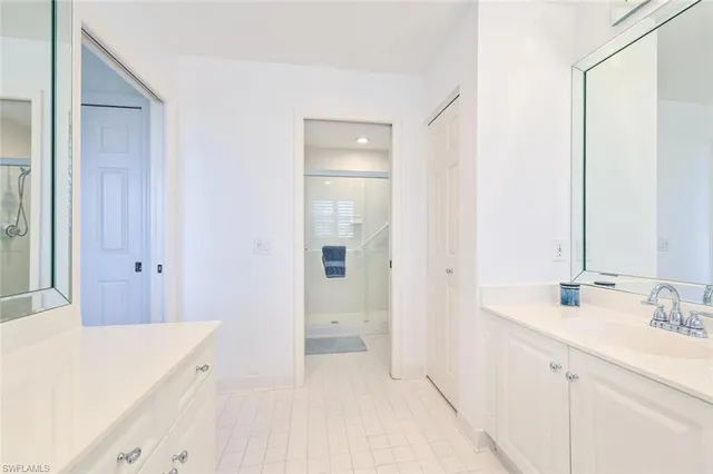 a bedroom with two beds and a window