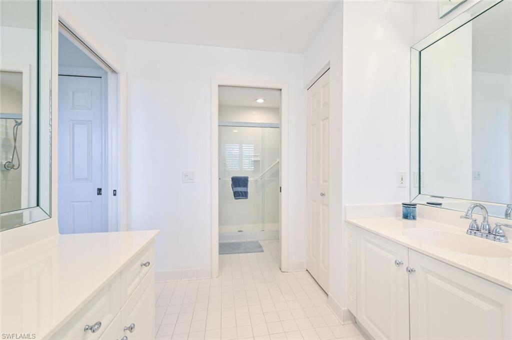 6549 Marissa Loop, Unit 26 Naples, FL 34108 - Photo 25 of 39 a spacious bathroom with a sink and a mirror