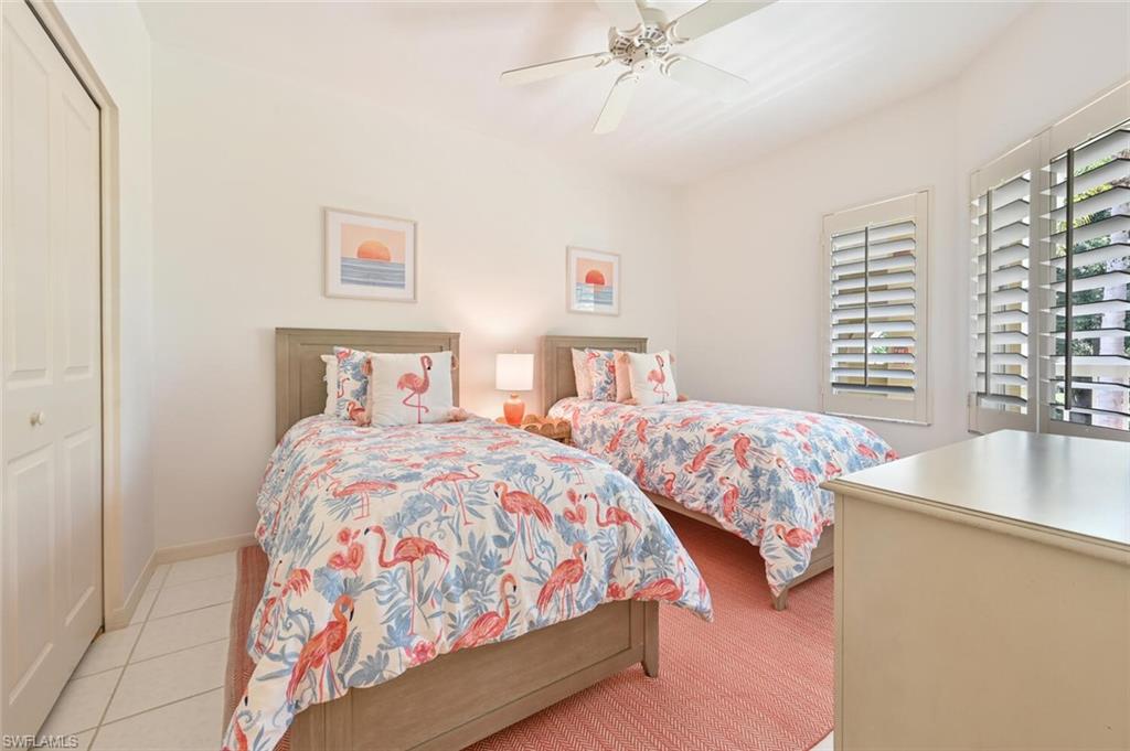 6549 Marissa Loop, Unit 26 Naples, FL 34108 - Photo 26 of 39 a bedroom with two beds and a window