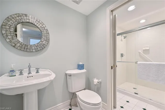 a bedroom with a bed and a table in it with window