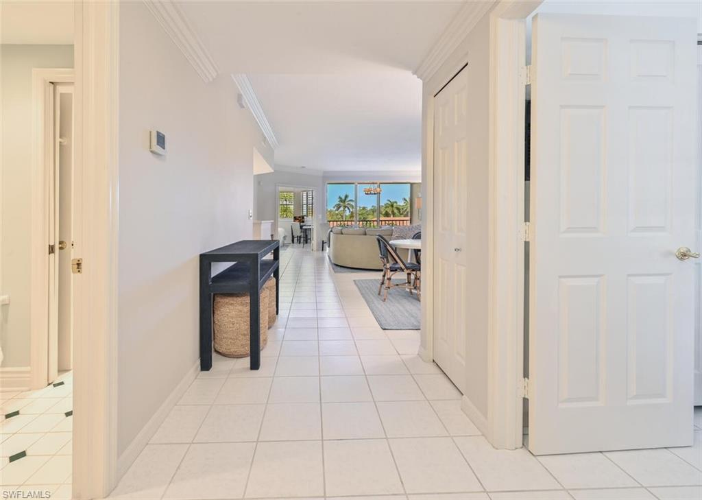 6549 Marissa Loop, Unit 26 Naples, FL 34108 - Photo 3 of 39 a view of a hallway with living room and furniture