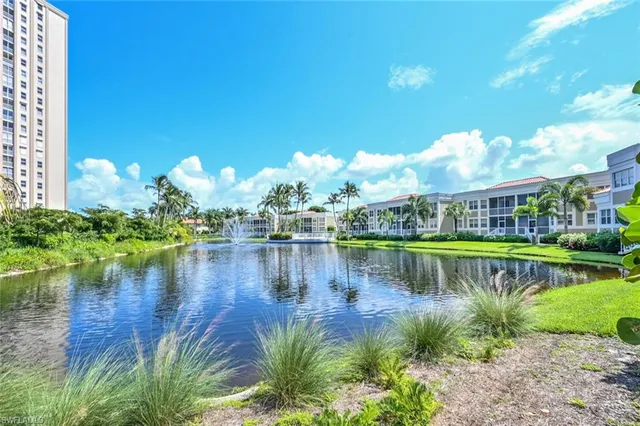 a view of balcony with wooden floor and fence