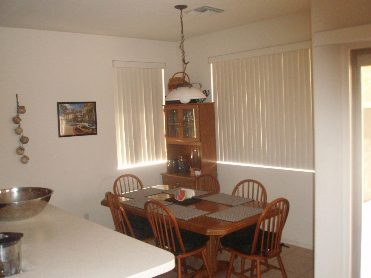 4230 South Splendor Place Gilbert, AZ 85297 - Photo 5 of 11 a dining room with furniture and window