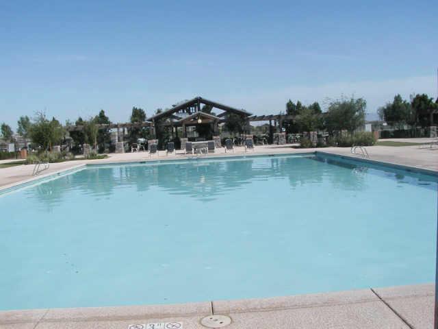 4230 South Splendor Place Gilbert, AZ 85297 - Photo 10 of 11 a view of a lake with houses