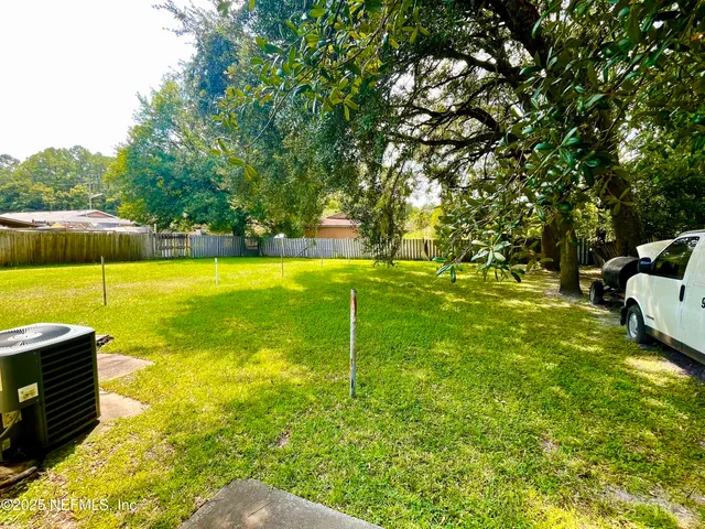 a swimming pool with some trees in the background