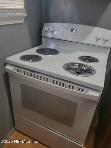 a kitchen with a stove and a microwave