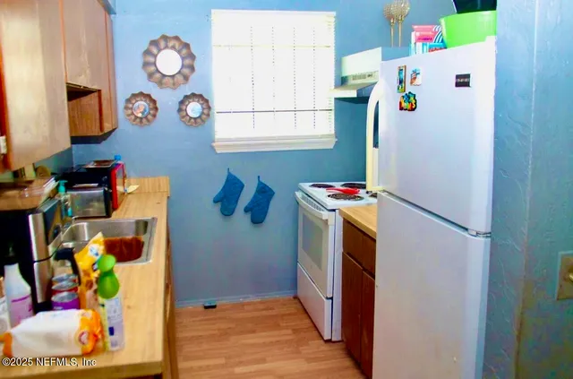 a view of a backyard with swimming pool