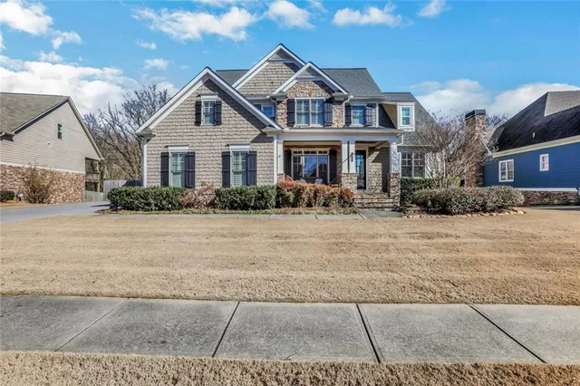 a front view of a house with a yard
