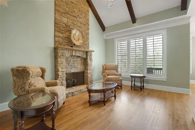 a view of a dining room with furniture wooden floor and chandelier
