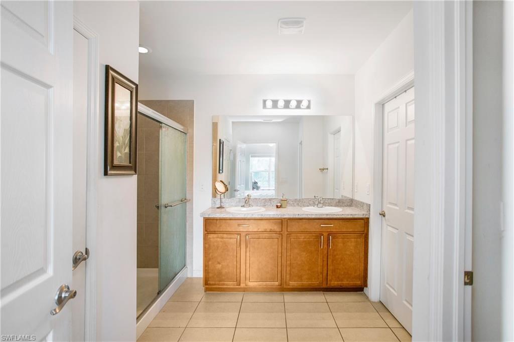 673 Hadley Street East Naples, FL 34104 - Photo 17 of 31 a view of a kitchen with electric appliances