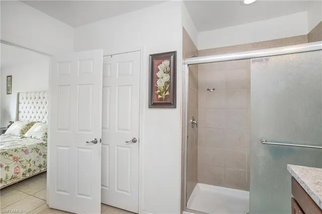 a bathroom with a bathtub and shower