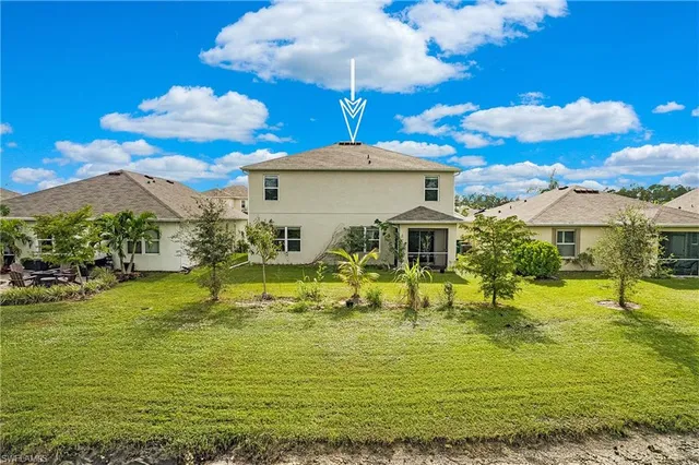 a view of a swimming pool with a table and chairs