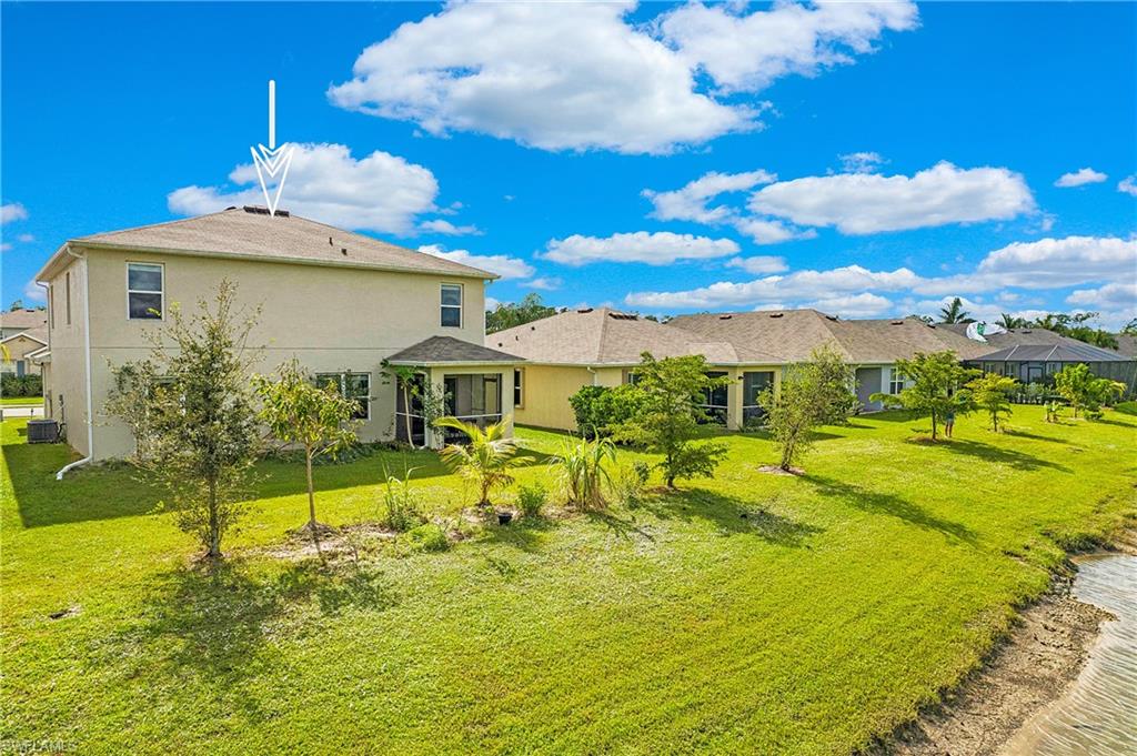 673 Hadley Street East Naples, FL 34104 - Photo 30 of 31 a view of a house with a swimming pool