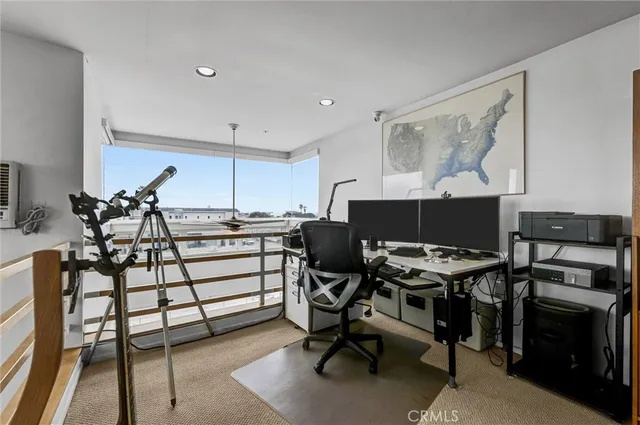 a view of a workspace with furniture