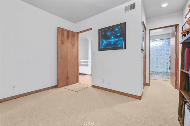 a view of a kitchen from the hallway