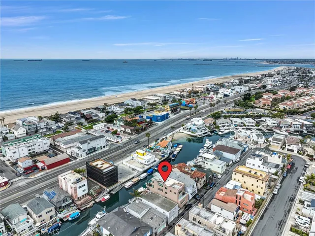 an aerial view of residential building and ocean view