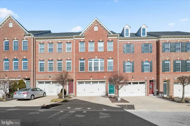 a front view of a building with lot of windows