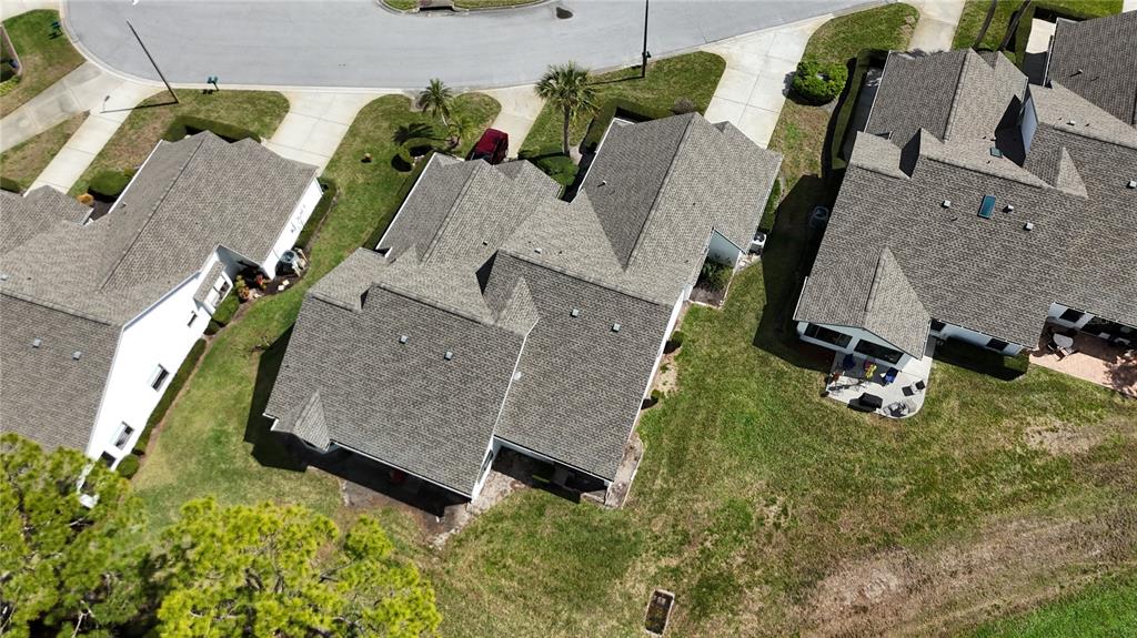 3637 Downfield Place, Unit 402 New Port Richey, FL 34655 - Photo 26 of 39 an aerial view of a house with a swimming pool