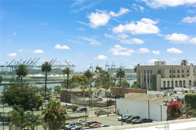 a view of a balcony with furniture and a city view