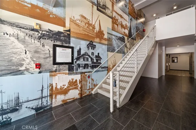 a large building with a table and chairs in front of it