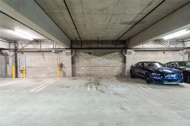 a view of a kitchen with furniture and wooden floor