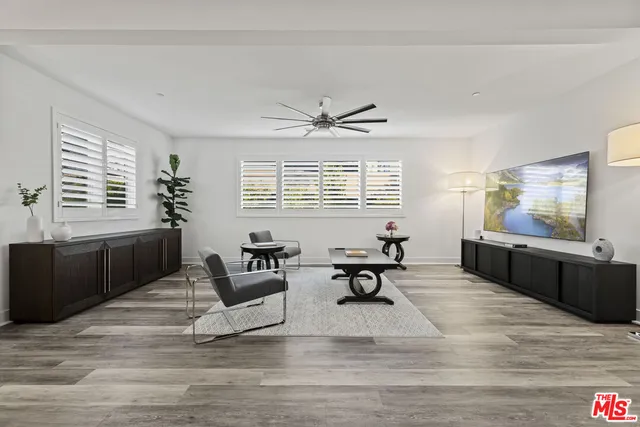 a spacious bathroom with a double vanity sink and a mirror