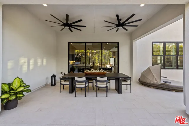 a outdoor living space with furniture and a potted plant