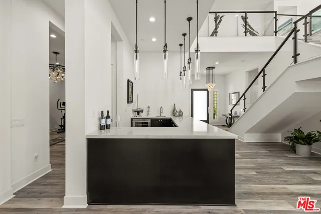 a large kitchen with a table and chairs