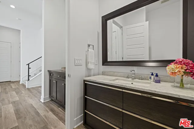 a bedroom with a bed and a television