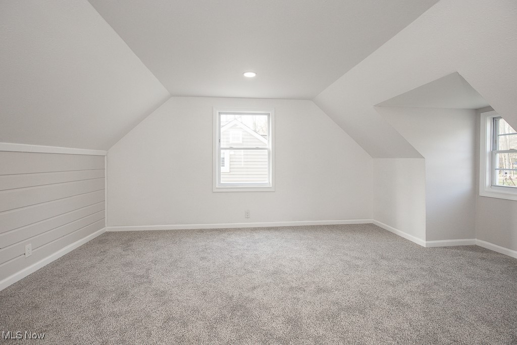223 Beck Road Avon Lake, OH 44012 - Photo 17 of 29 Additional living space on second floor with baseboards, carpet floors, and lofted ceiling