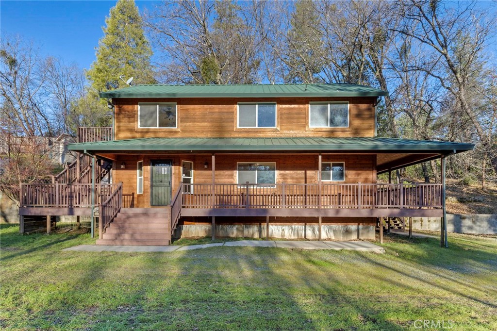 a house with river in front of it