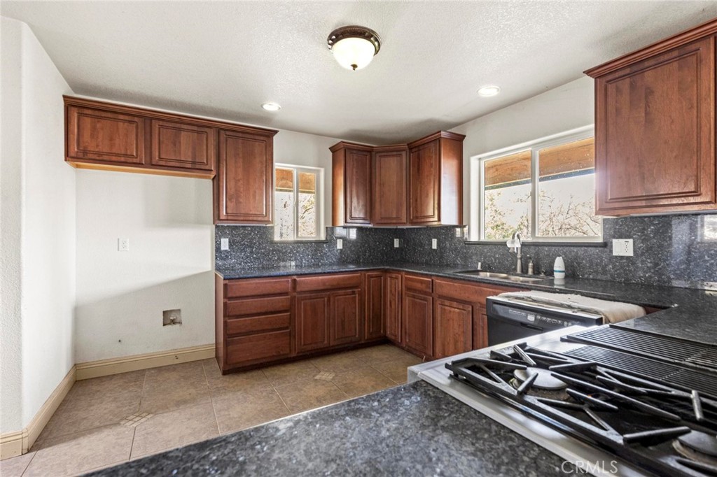 10761 Texas Hill Road Dobbins, CA 95935 - Photo 18 of 58 a kitchen with sink window and cabinets
