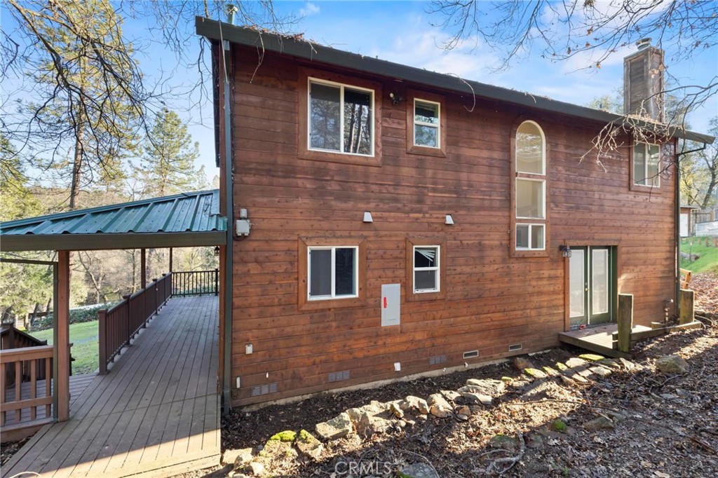 10761 Texas Hill Road Dobbins, CA 95935 - Photo 31 of 58 a front view of a house with a yard