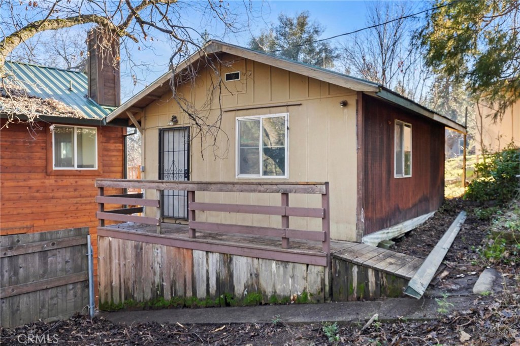 10761 Texas Hill Road Dobbins, CA 95935 - Photo 32 of 58 a front view of a house with balcony