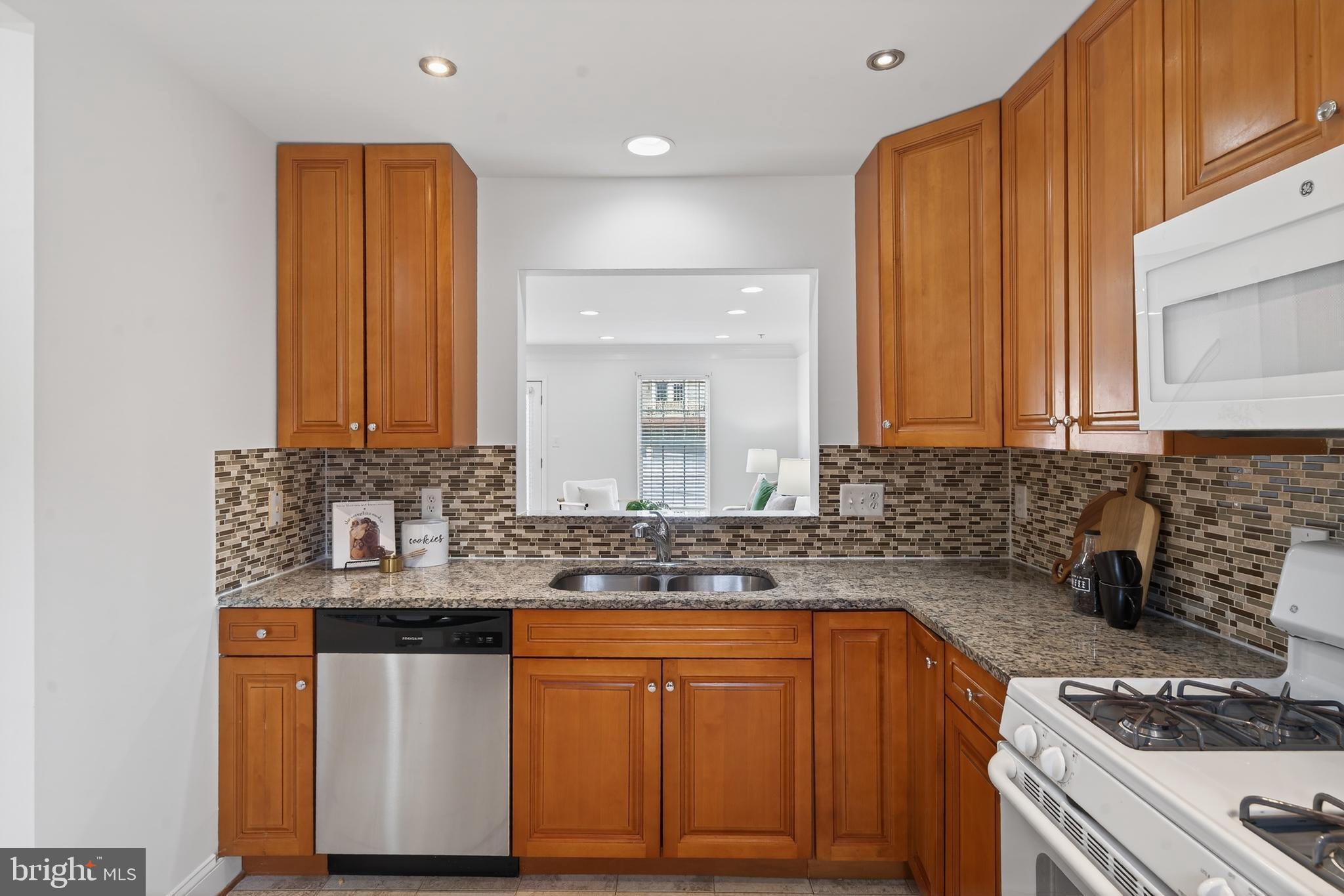 23616 Public House Road Clarksburg, MD 20871 - Photo 5 of 35 a kitchen with stainless steel appliances granite countertop a sink stove and cabinets