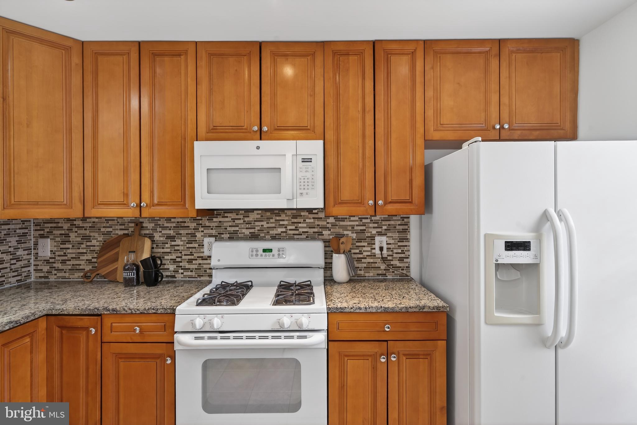 23616 Public House Road Clarksburg, MD 20871 - Photo 6 of 35 a kitchen with a stove top oven sink and cabinets