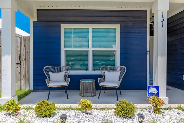 a outdoor living space with furniture and a potted plant