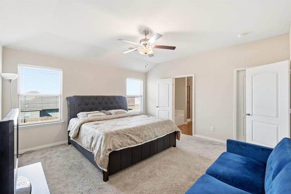 227 Curt Street Anna, TX 75409 - Photo 18 of 40 a spacious bedroom with a bed and window