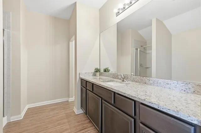 a spacious bedroom with a bed and window