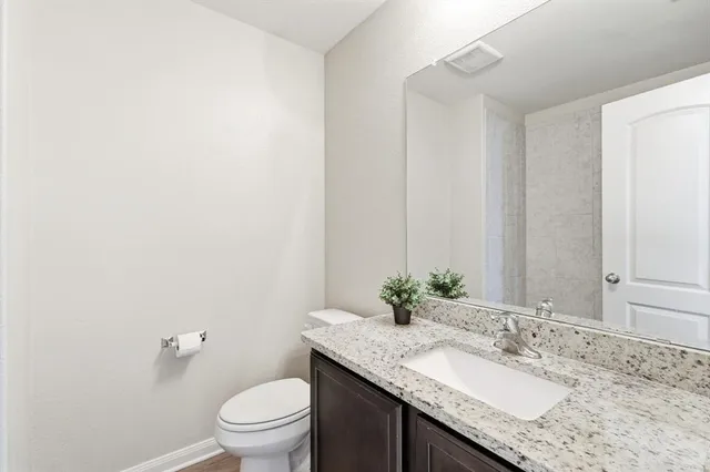 a bedroom with a bed and a chair