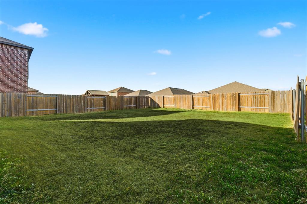 227 Curt Street Anna, TX 75409 - Photo 35 of 40 a house view with a garden space