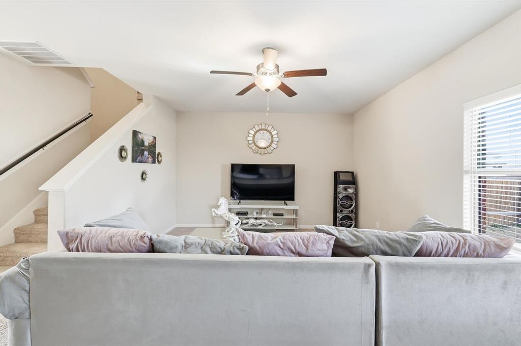 227 Curt Street Anna, TX 75409 - Photo 5 of 40 a living room with furniture and a flat screen tv